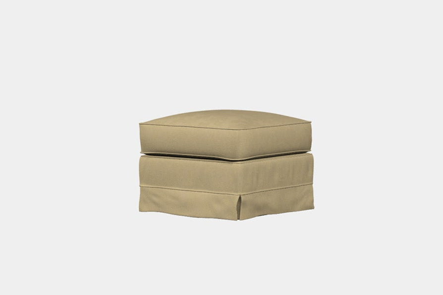 A beige fabric footstool with a square top and a removable cover, against a white background.