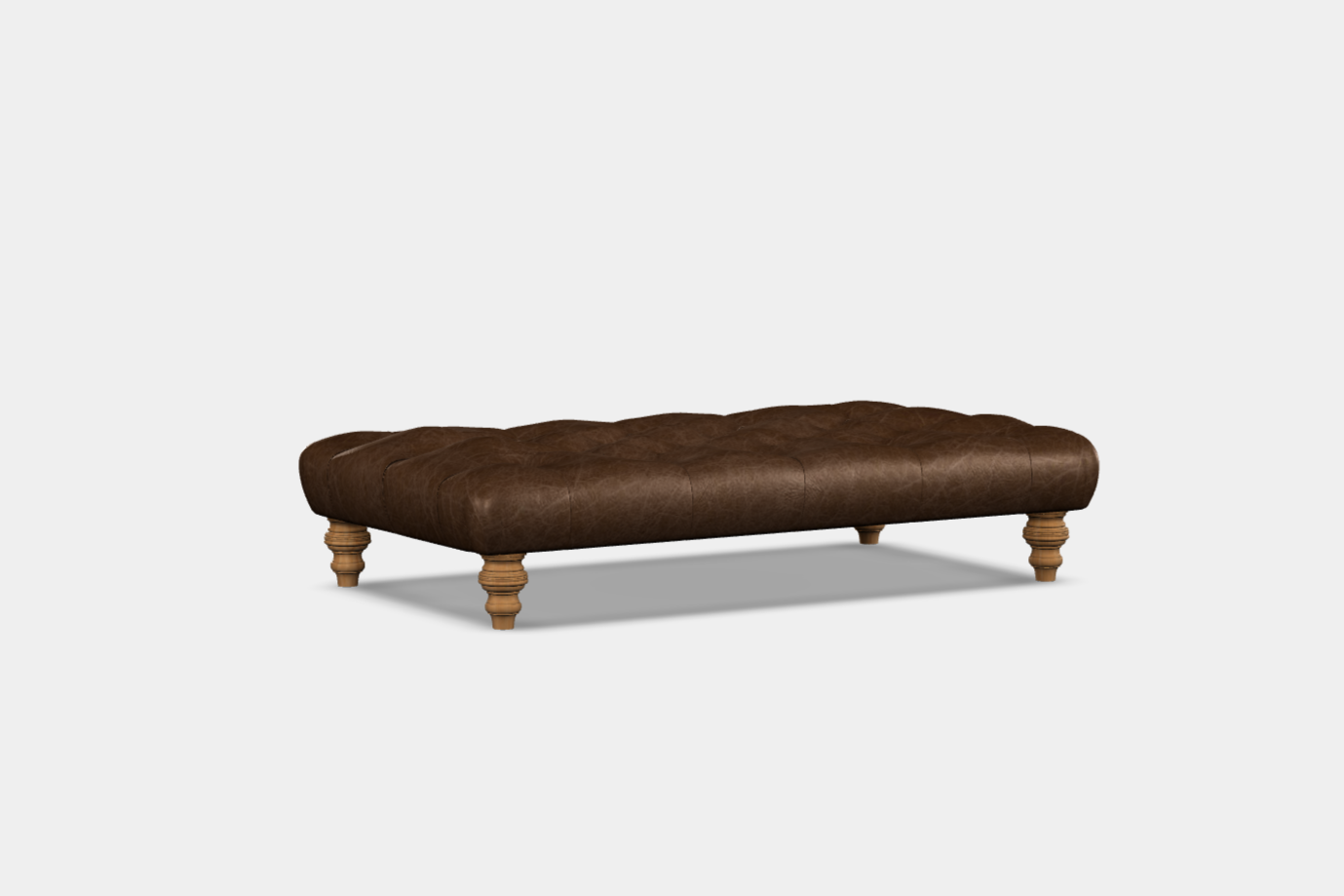 A rectangular buttoned ottoman in brown fabric with wooden legs, presented against a white background.