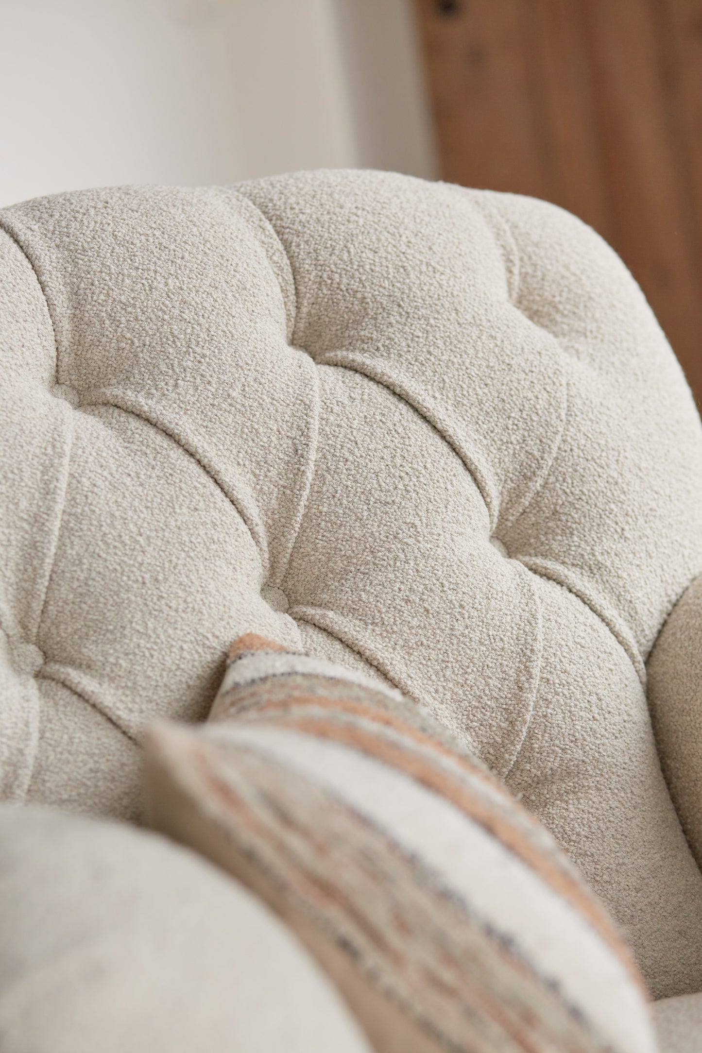 Tetrad Duffel Chair in Bottega Natural Bouclé. Scandi styling in converted barn location.