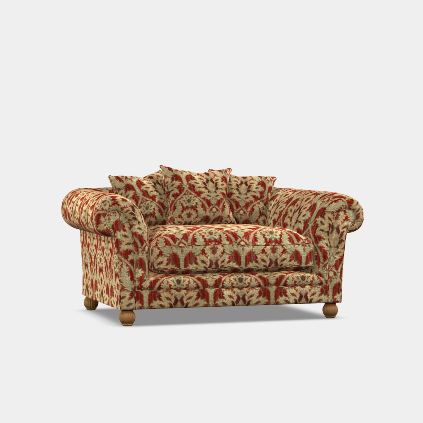A patterned fabric sofa with large scroll arms, low back, and hardwood feet, upholstered in a red and beige floral design.