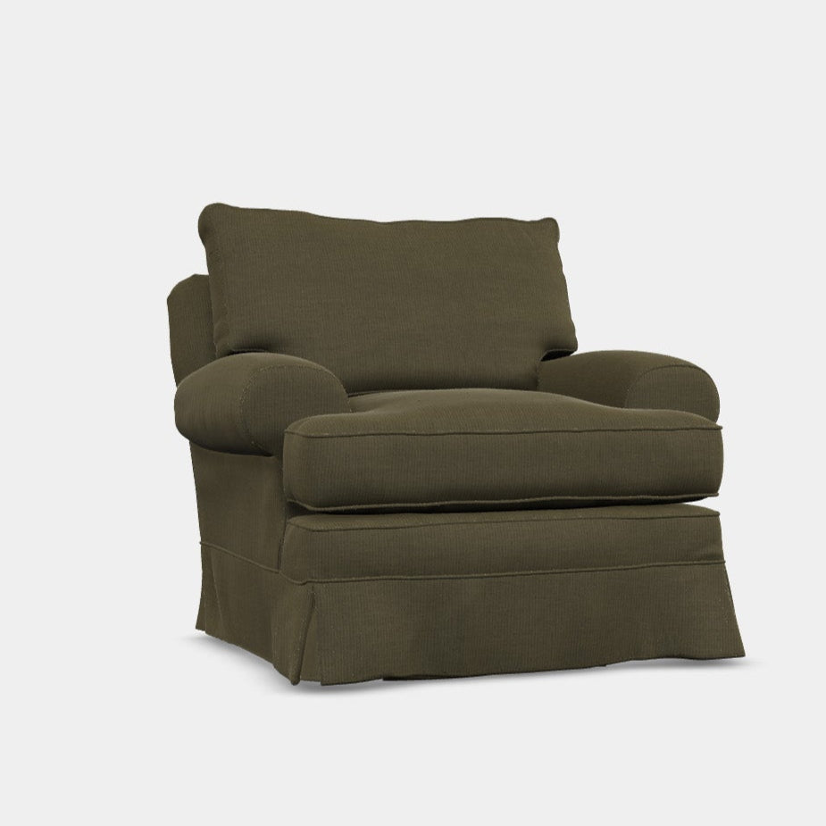 A green upholstered armchair with a loose cover design, featuring a back cushion that appears to be feather filled.