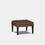 A brown upholstered square stool with deep button design and leather piping, set against a white background.