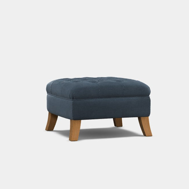 A round blue upholstered footstool with stylish hardwood legs.