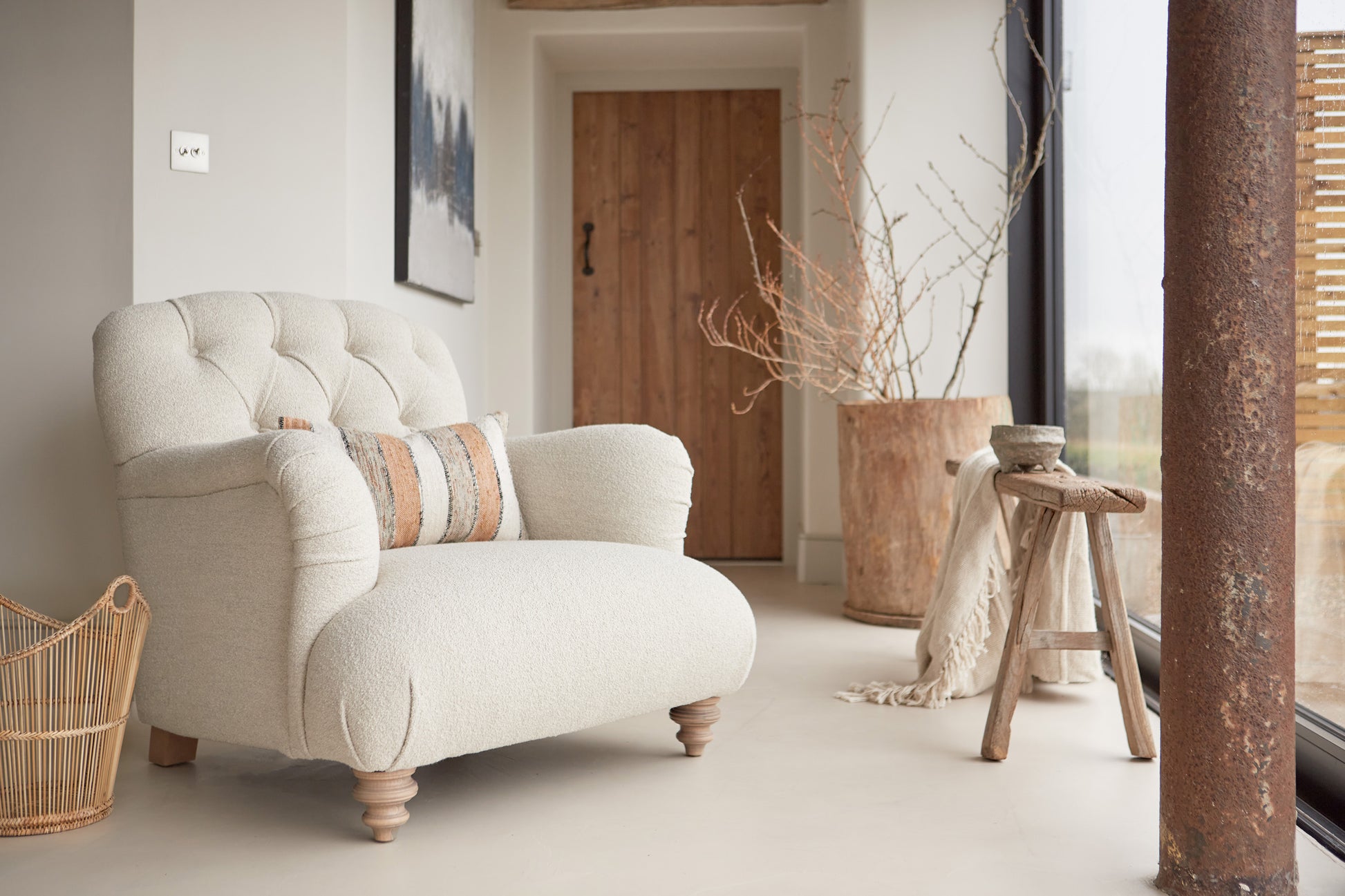 Tetrad Duffel Chair in Bottega Natural Bouclé. Scandi styling in converted barn location. 